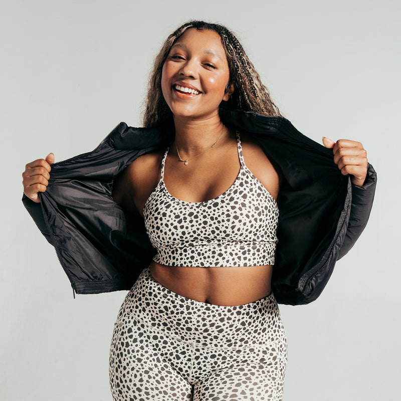 Power sports bra for women in animal dot print, scoop neckline with supportive underband