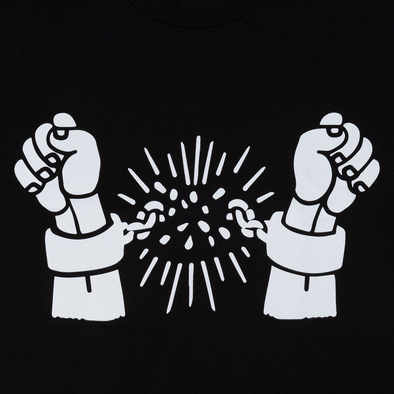 Black men's t-shirt close-up: two raised fists with starburst graphic