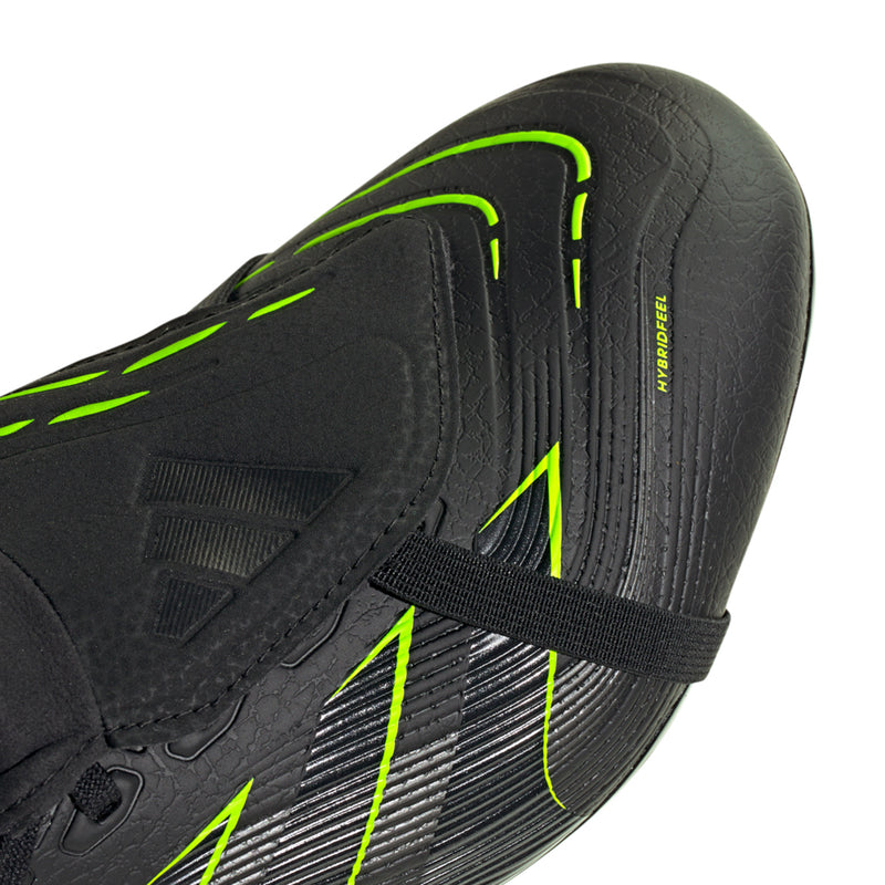 Men's black cleat upper close-up with neon green stripes and adjustable strap