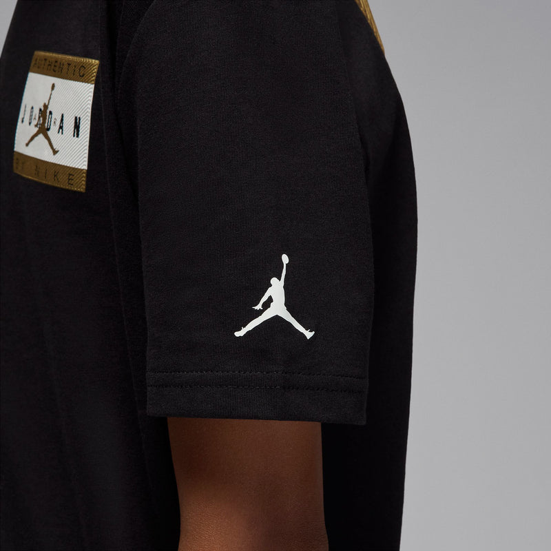 Youth black tee sleeve hem with white Jumpman-style logo