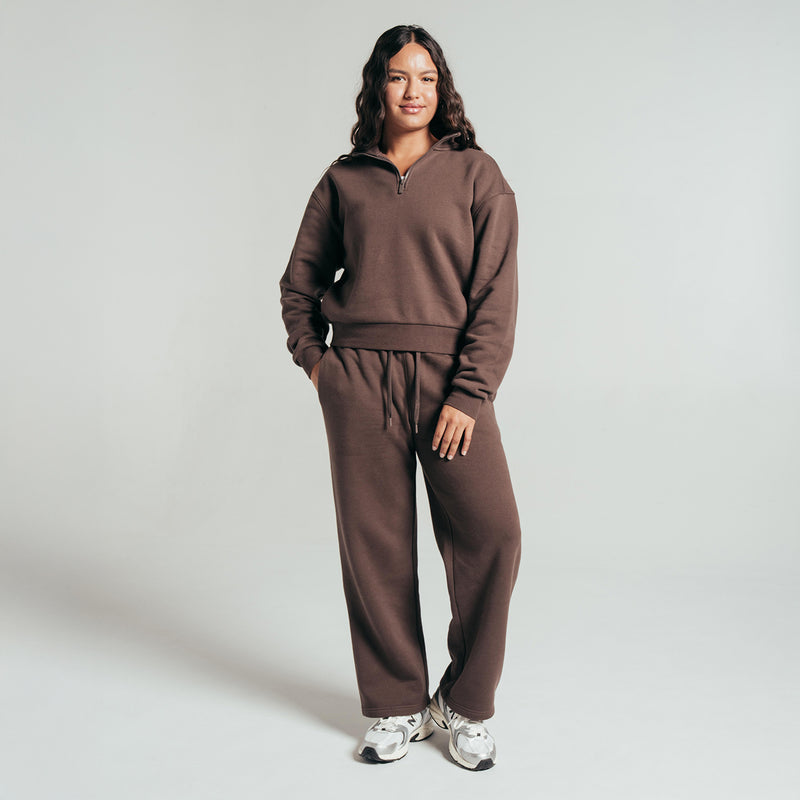 Chocolate brown women's fleece half-zip pullover with drawstring waist and pocket