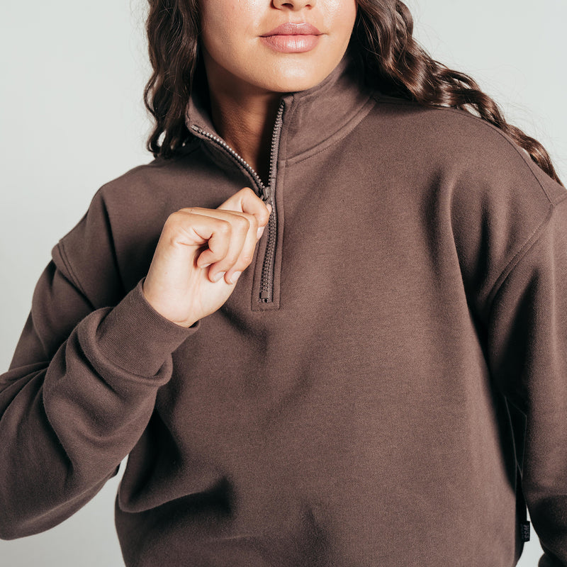 Chocolate brown fleece half-zip pullover with stand collar and zipper pull