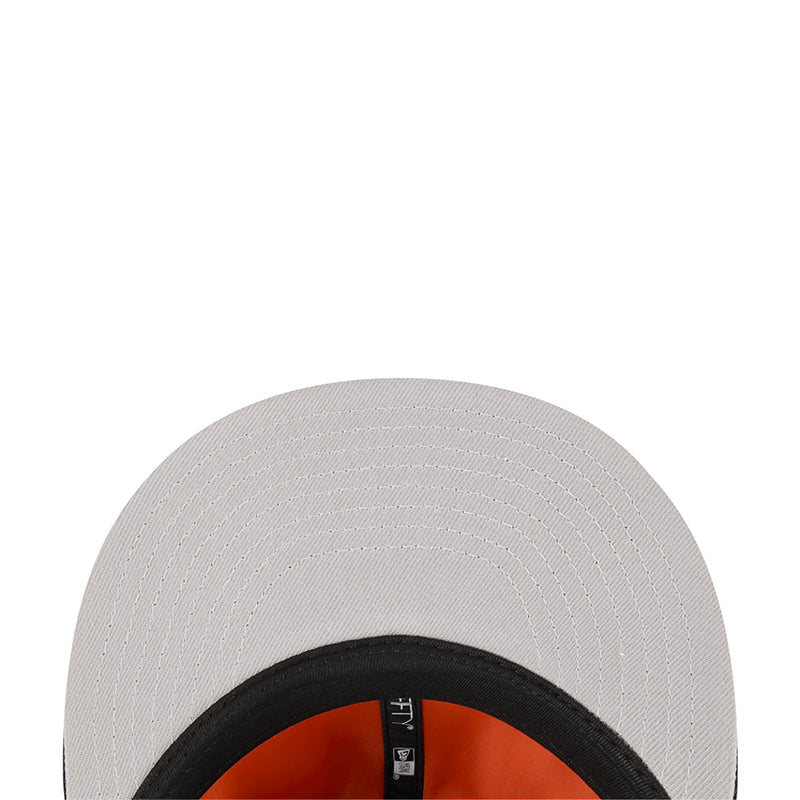 Light gray baseball cap closeup of crown and black brim lining