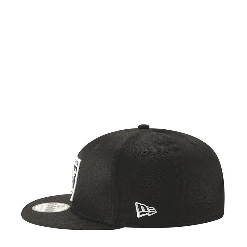 Black Raiders cap with New Era flag logo on side, adjustable snapback