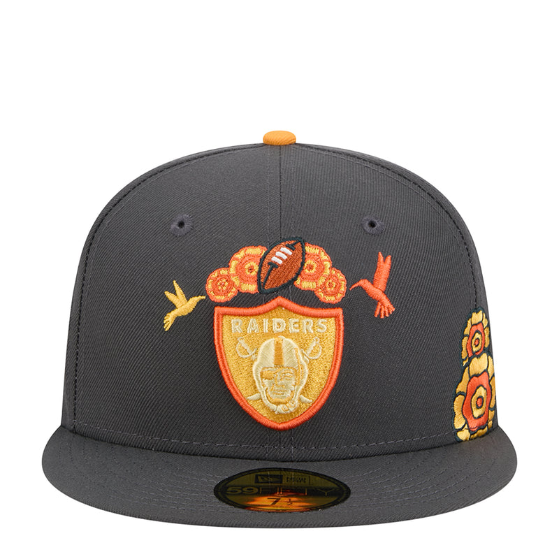 Dark grey baseball cap with orange top button, Raiders crest, marigold and bird patches