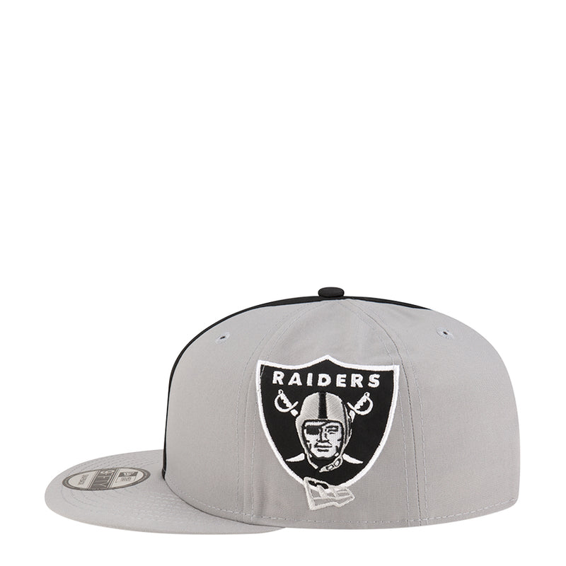 Light grey snapback cap with Raiders shield patch centered