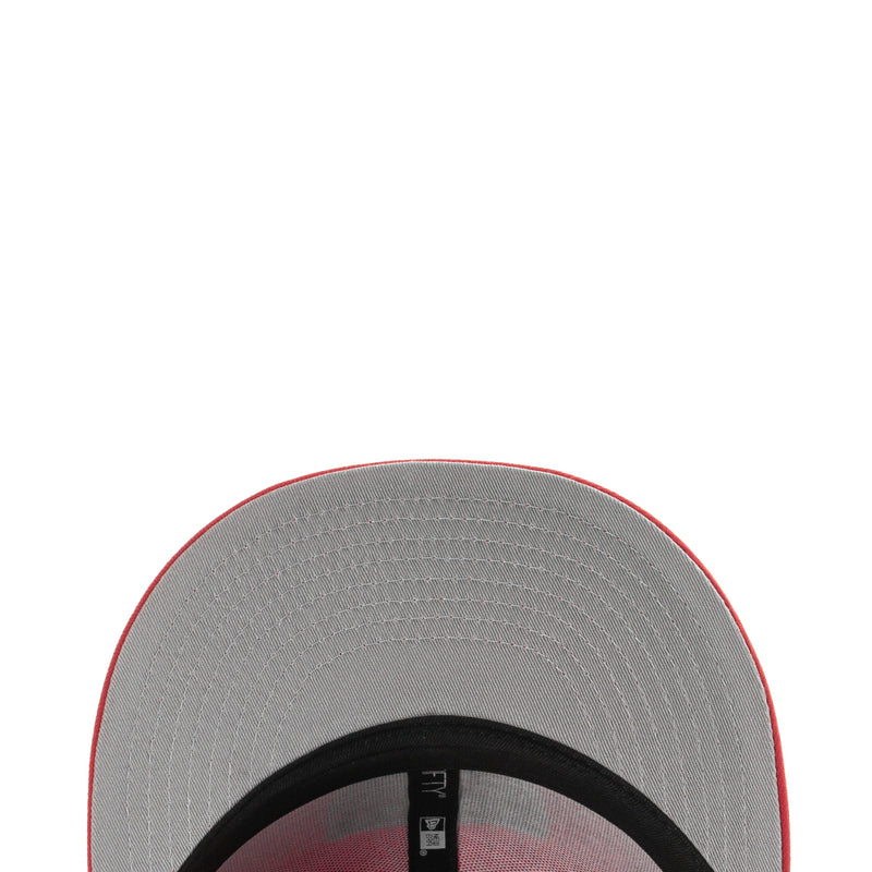 Gray cap brim underside with black band trim and stitched edge