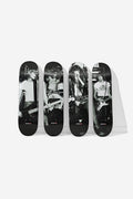 Ramones Collector's Set four 8.25 inch decks upright with grayscale CBGB performance photos against a white wall.