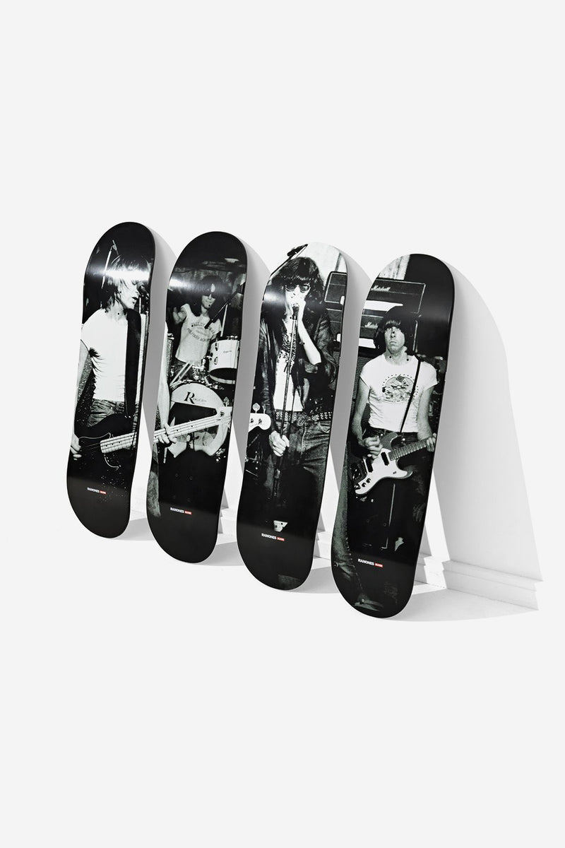 Ramones four 8.25 inch decks lined up on the floor with grayscale stage images from CBGB.