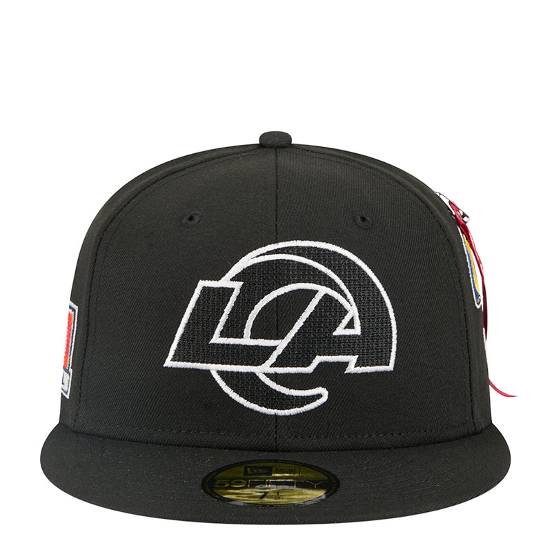 Black baseball cap with white Rams graphic on front and multicolor side embroidery.