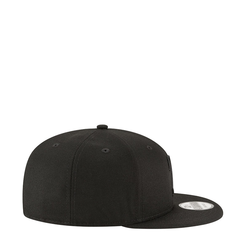 Black baseball cap side view with stitched eyelets and adjustable back strap