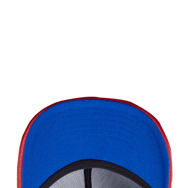 Blue cap crown with red-edged brim showing inner black trim detail