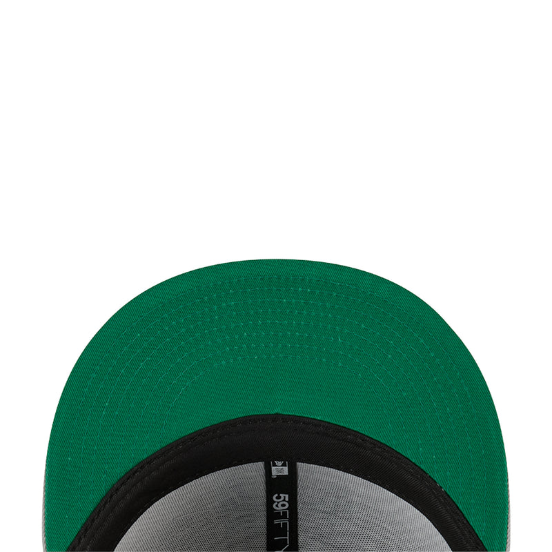 Baseball cap brim underside in green with black inner band and “5950” tag
