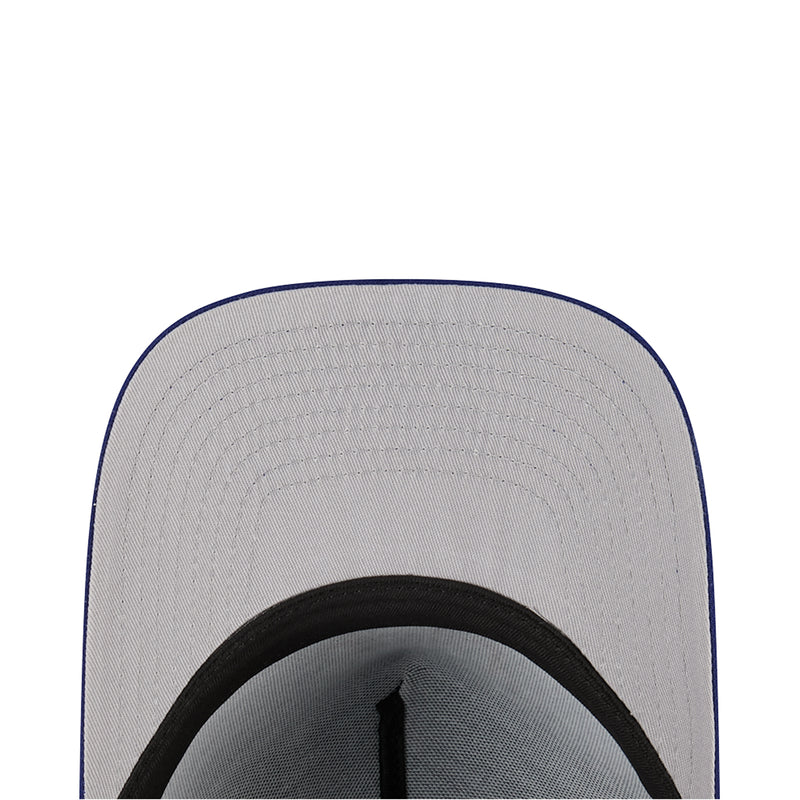 Baseball cap brim close-up with black inner lining and stitched edge