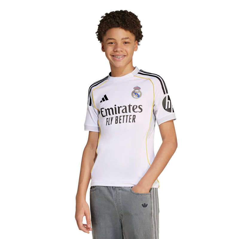 Youth Real Madrid home replica jersey, white with club crest and Emirates Fly Better text