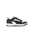 Kids' black and white Puma sneakers with lace-up front and strap overlay