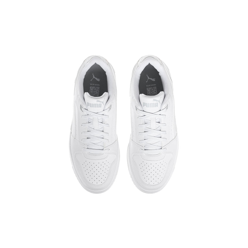 Youth Puma white sneakers viewed from above, lace-up eyelets and perforated toe
