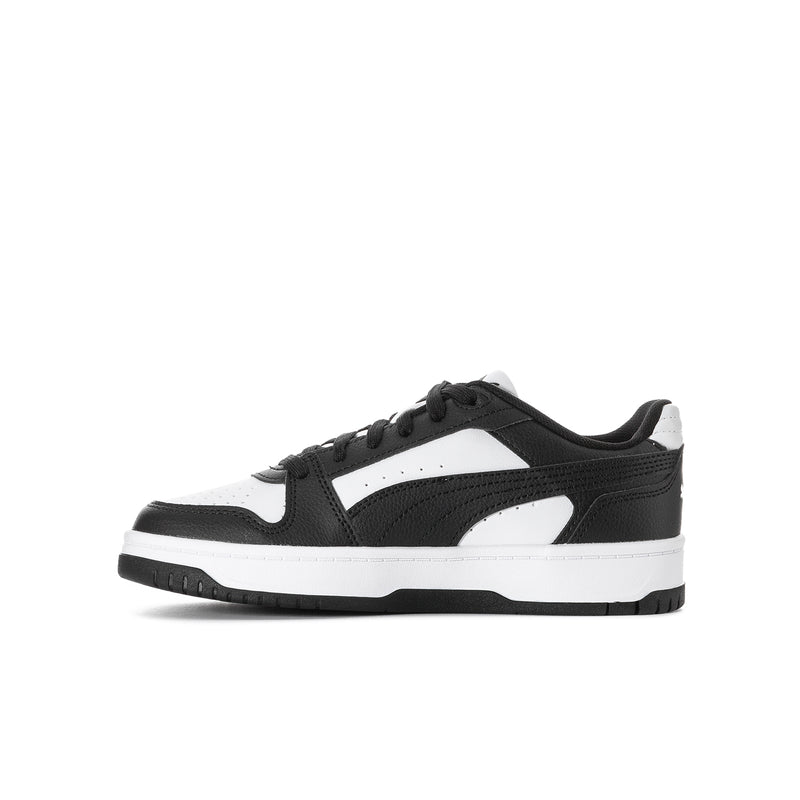 Youth low-top lace-up sneakers in black and white with side stripe detail and tread sole
