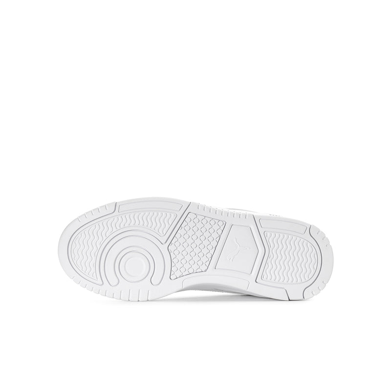 White Puma youth sneaker outsole with patterned traction tread and center circle