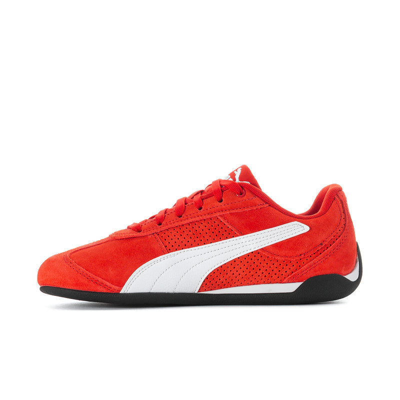 Women's red suede sneakers, front 3/4 view with white band and lace-up