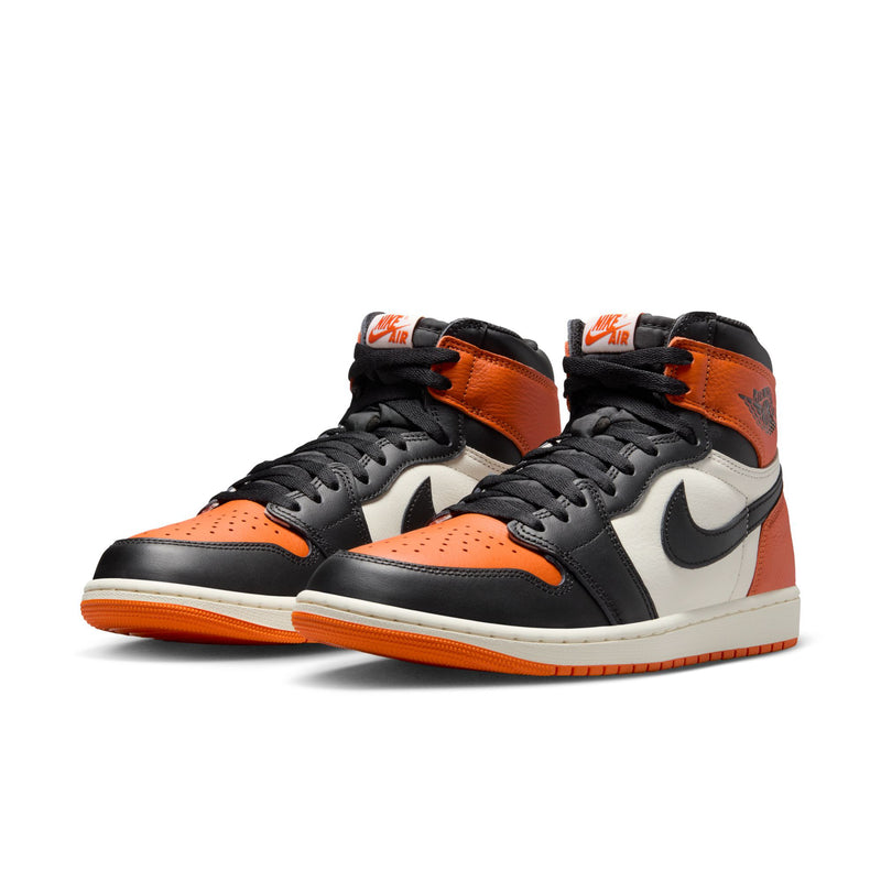 Men's high-top sneakers, orange and black with white panels, lace-up pair.