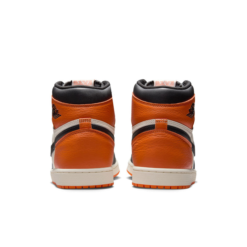 Men's high-top sneakers heel view, orange overlays with white midsole and black collar.