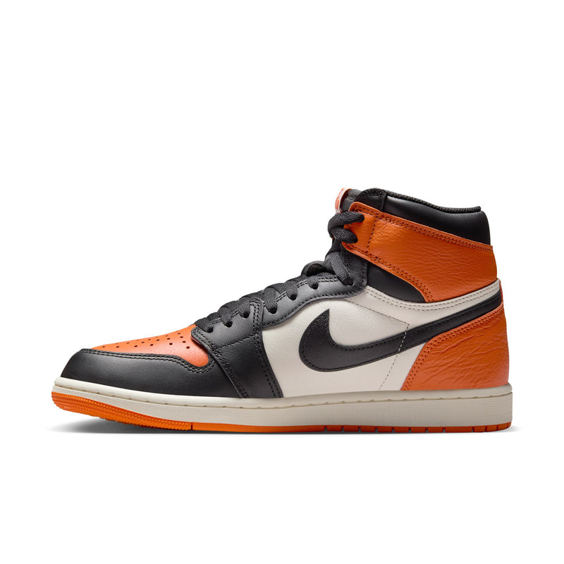 Men's high-top sneakers side profile, black swoosh and orange panel with white midsole.
