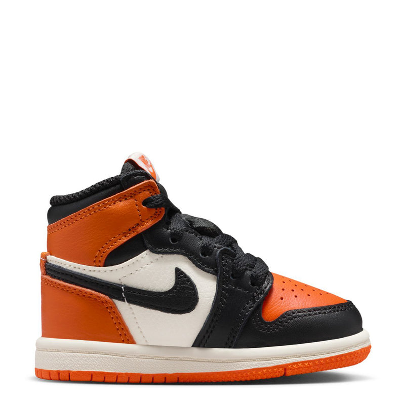 Toddler high-top sneakers in black, orange, and white with Nike swoosh and laces