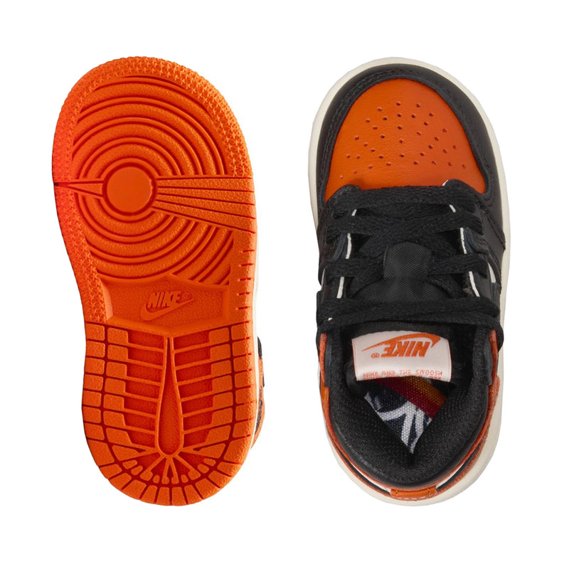 Toddler sneaker outsoles: orange tread bottoms and black-and-orange insole opening