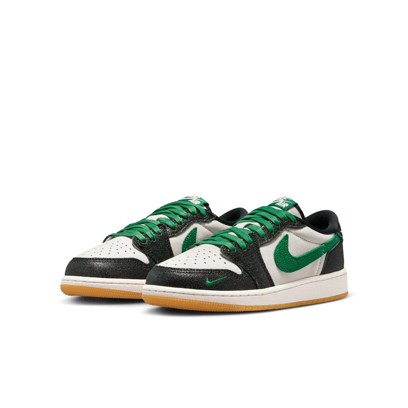 Youth low-top sneakers, side view, white leather with black panels and green swoosh