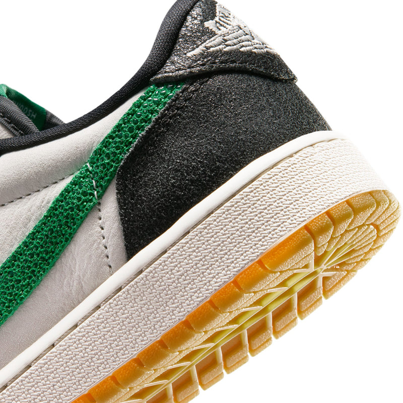 Close-up of youth sneaker sole edge and side panel texture, white and gum details
