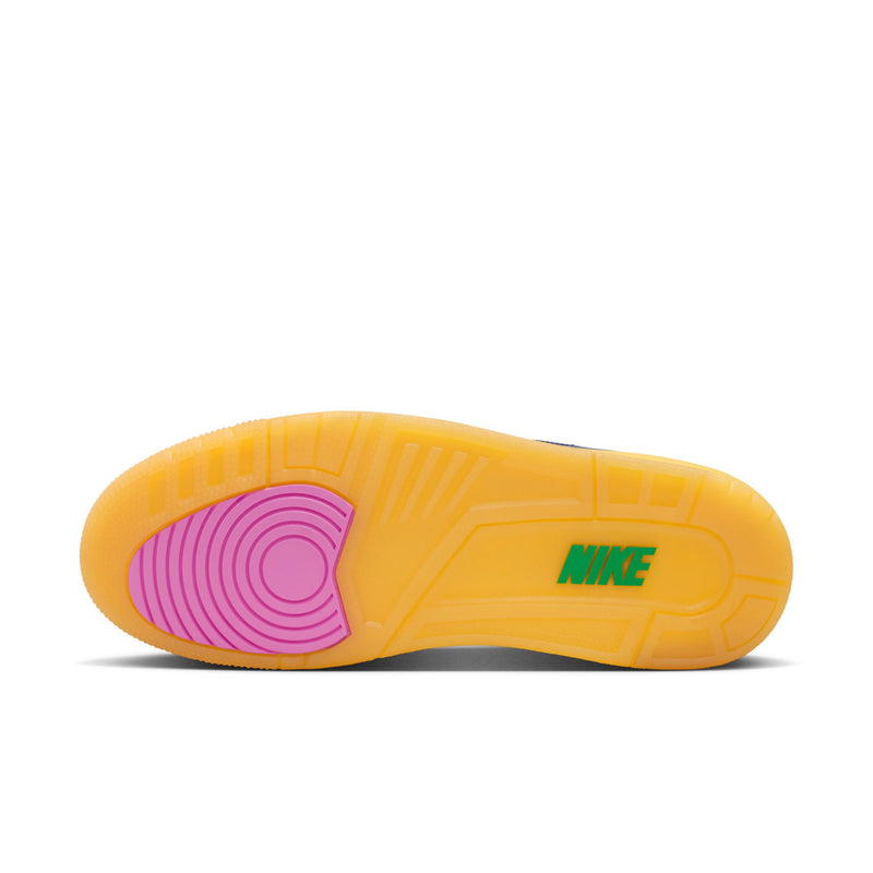 Outsole view of men's retro high-top sneakers in yellow with pink traction pattern, Nike mark.