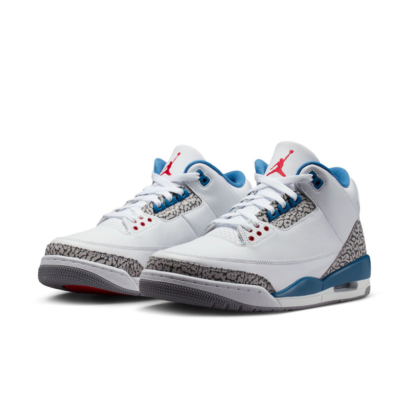 Men's white and blue Retro-style Jordan sneakers with elephant print and red accents