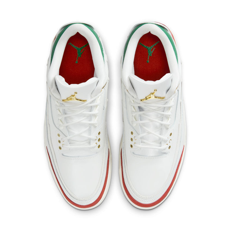 Front view of white retro sneakers with red lining and gold lace hardware