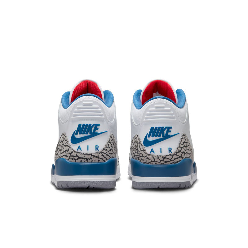 Men's white and blue sneakers with NIKE AIR branding on the heel and red lining