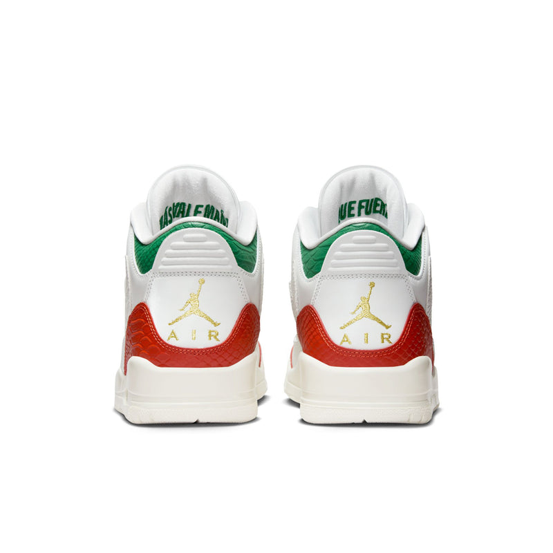Back view of white retro sneakers with green heel tabs, red Air logo