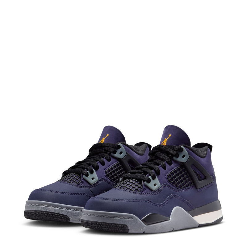 Pair of kids’ purple athletic sneakers with black laces and gray midsoles