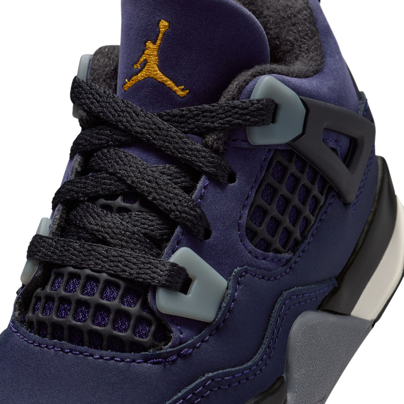 Toddler dark purple sneaker close-up with yellow Jumpman logo, black laces, teal heel accents