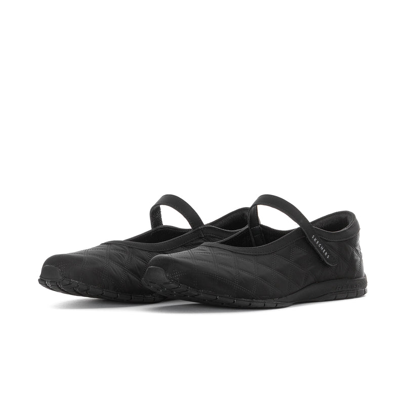 Black mary jane flats, angled side view with molded sole and textured upper