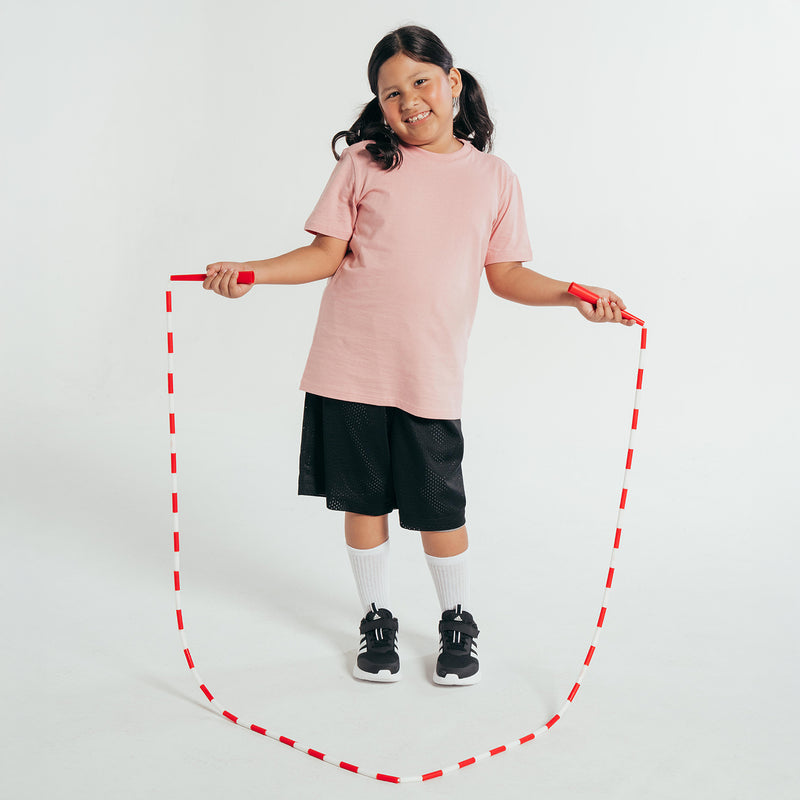 Youth basketball shorts in black, mid-thigh length with elastic waistband