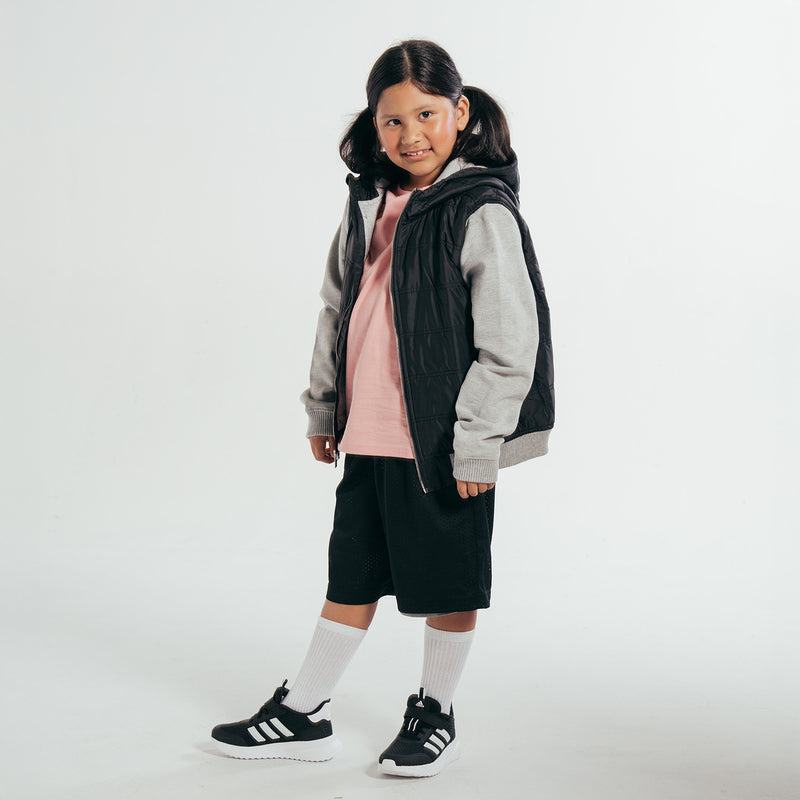 Youth basketball shorts in black with perforated look and elastic waistband