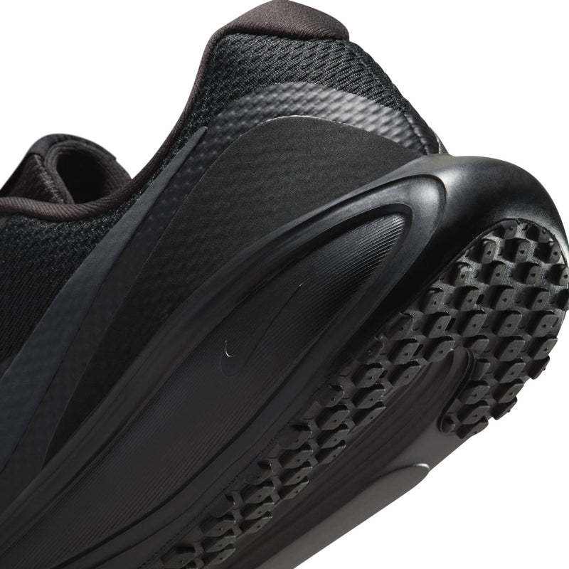 Women’s black running sneaker side close-up with swoosh and rubber outsole