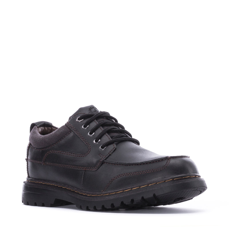 Men's black lace-up Oxford-style shoe with stitched panels and rubber tread sole