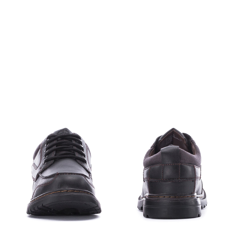 Men's black lace-up shoe heel and back collar with rubber outsole tread