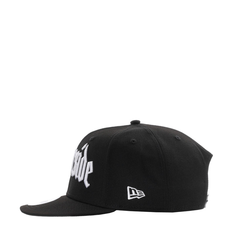 Black snapback cap with white front logo and New Era flag emblem