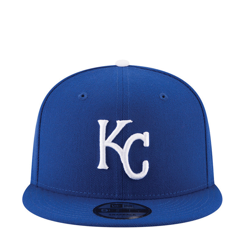 Royal blue baseball cap with white KC logo on the front