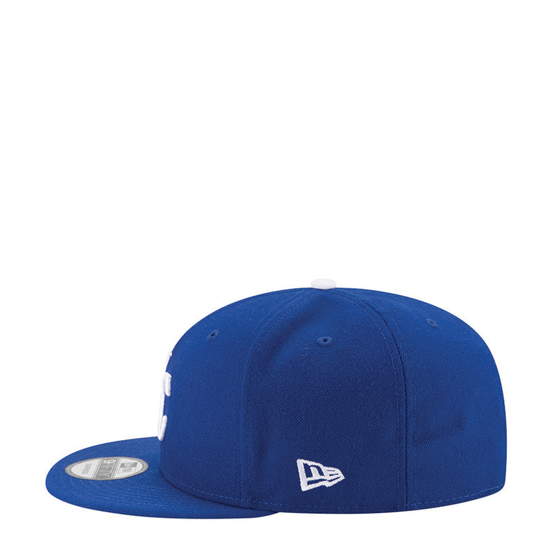 Royal blue baseball cap side view with New Era flag logo