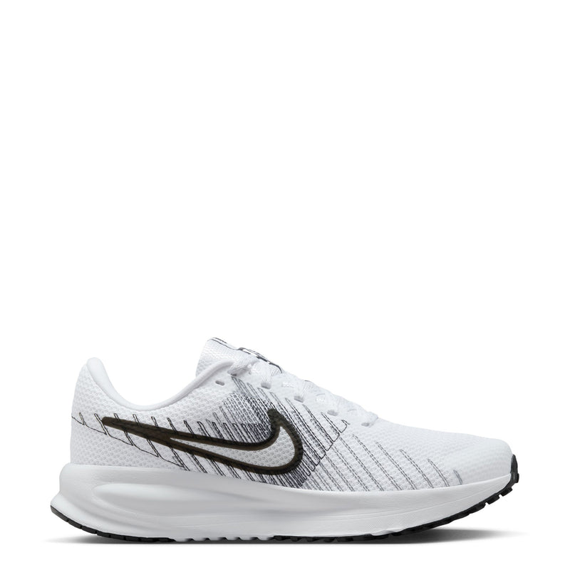 Women's running shoe side view in white with black Swoosh and sculpted midsole
