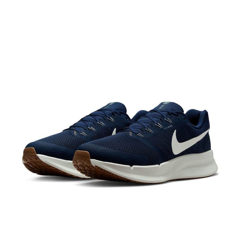 Men's midnight navy running shoes, side view, white swoosh and gum outsole