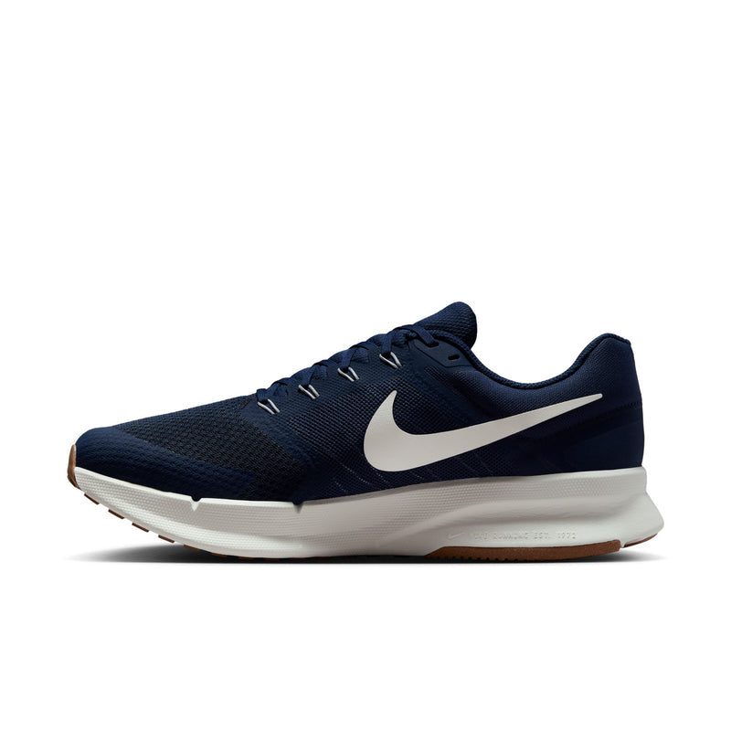 Men's midnight navy running shoes, angled profile, white swoosh and gum outsole